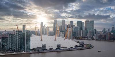 Huge white dome building with yellow metal structures