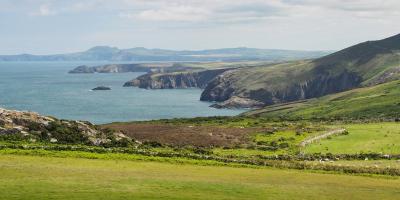 View from the St Davids peninsula of the coves, cliffs and rocky outcrops along the dramatic coastline, Pembrokeshire Coast National Park, Wales, UK