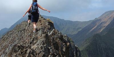 Person climbing a mountain