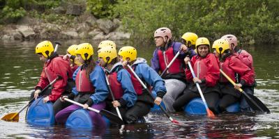 Group on young people making a raft in the Peak District