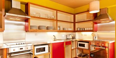 Kitchen with bright pink cabinets and crockery on display