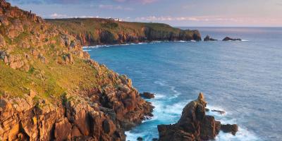 Rocky cliffs overlooking a dramatic blue ocean