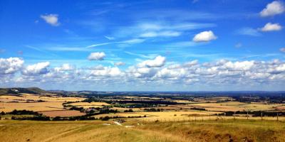 View over vast countryside with blue skies above