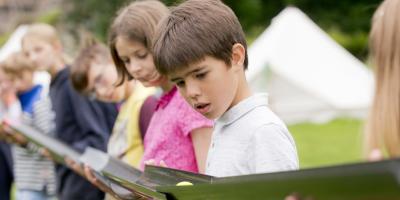 Children on a YHA School trip reading Alex Rider