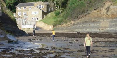 Family on the beach at YHA Boggle Hole