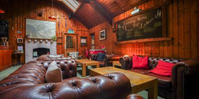 Seating area with brown chesterfield sofas