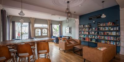 Bakery and café area with seating and view out of the windows