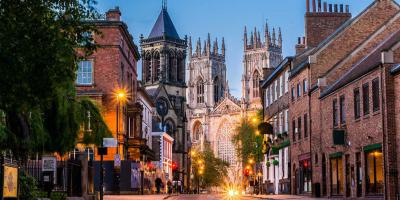 Road leading to historic buildings including a the York Minster cathedral