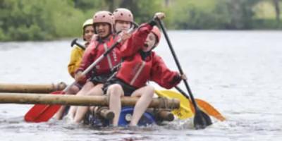 Group canoeing on a river