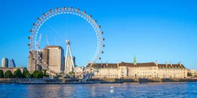 London Eye on riverbank of thames river