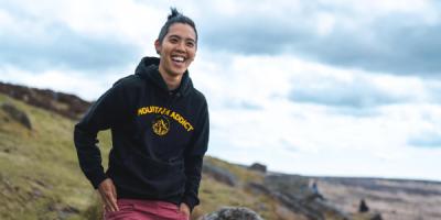 Filmmaker Frit Tam smiling in the countryside