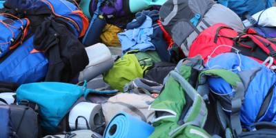 Pile of backpacks in different colours