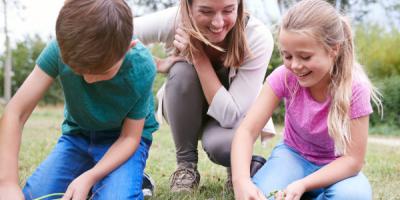 Teacher with children doing an outdoor activity