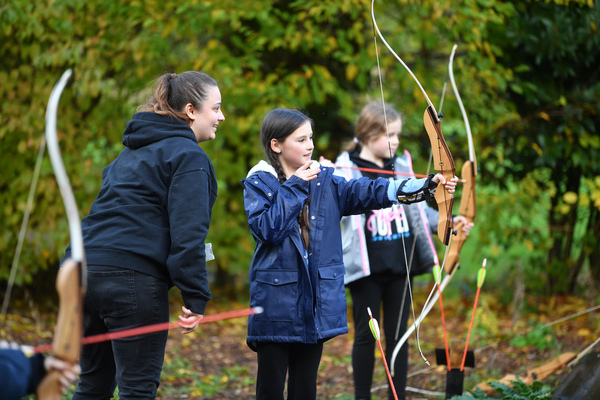 Child practicing archery at YHA Chester Trafford Hall