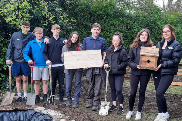 Group of young volunteers gardening at YHA