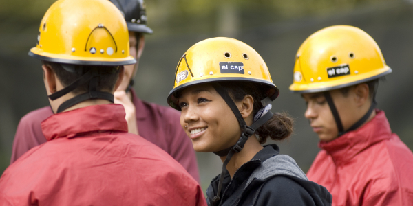 Group of young people wearing safety hard hats