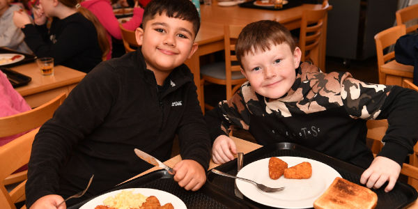 Children eating breakfast at YHA Chester Trafford Hall